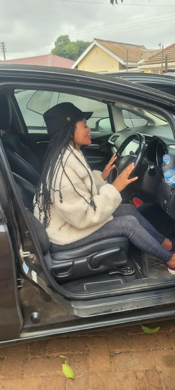 A happy VenMax customer enjoying a rental vehicle
